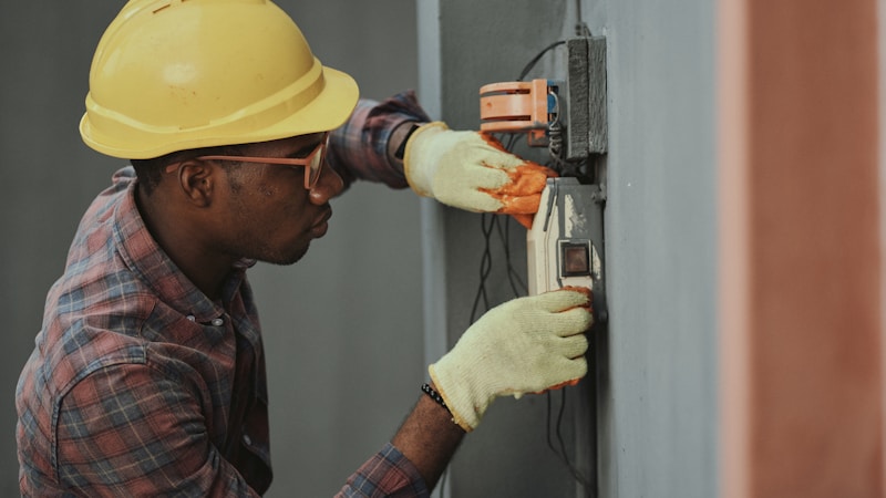 Technician performing maintenance on a commercial flue system
