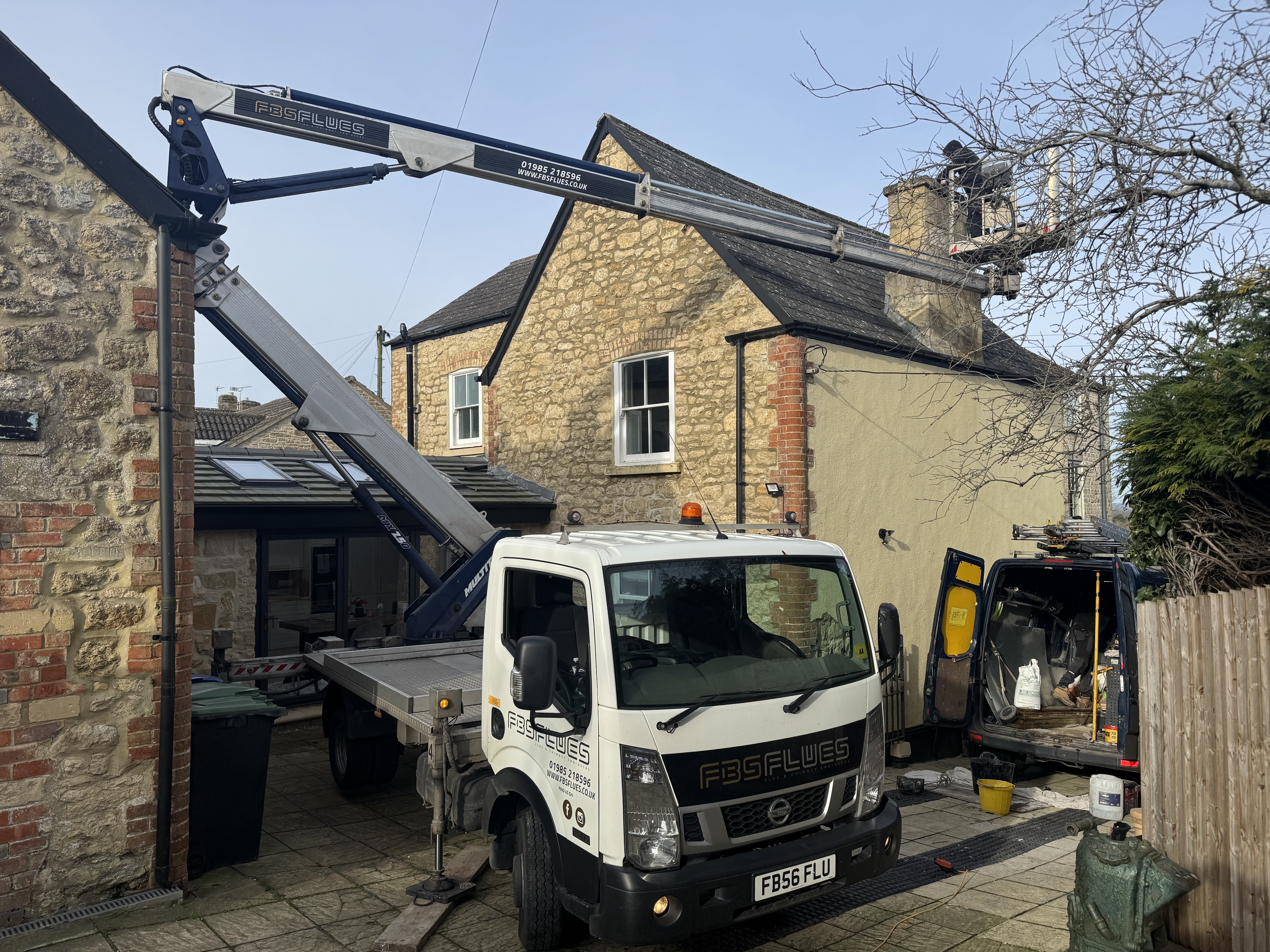 Stainless steel flexible chimney liner being installed